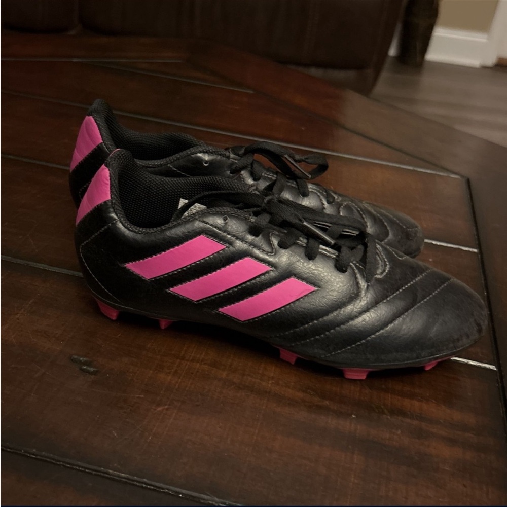 Pink and black Adidas soccer/football cleats